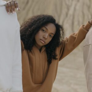 Elegant fashion portrait with neutral tones highlighting contemporary style and design.